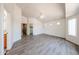 An expansive bedroom with wood-look flooring, a ceiling fan, and windows for plenty of natural light at 3545 W Glass Ln, Phoenix, AZ 85041