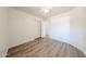 Bedroom showcasing wood-look floors, a ceiling fan, and a convenient closet for storage at 3545 W Glass Ln, Phoenix, AZ 85041