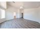 Spacious bedroom with wood-look flooring, ceiling fan, and multiple windows for ample natural light at 3545 W Glass Ln, Phoenix, AZ 85041