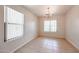 Bright dining room area featuring neutral paint, tile flooring, and a chandelier fixture at 3545 W Glass Ln, Phoenix, AZ 85041