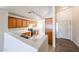 Bright kitchen featuring wooden cabinetry, laminate countertops, wood look flooring, and track lighting at 3545 W Glass Ln, Phoenix, AZ 85041