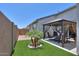 Beautiful backyard featuring artificial turf, desert landscaping, and a shaded gazebo for outdoor living at 38144 W San Clemente St, Maricopa, AZ 85138