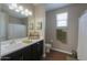 Bathroom with tiled floors, modern fixtures, and neutral color palette at 38144 W San Clemente St, Maricopa, AZ 85138