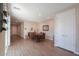 Open concept living featuring a dining area adjacent to an entry and sliding glass doors to a patio at 38144 W San Clemente St, Maricopa, AZ 85138