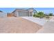 Charming home featuring a spacious two-car garage, desert landscaping, and a well-maintained front yard at 38144 W San Clemente St, Maricopa, AZ 85138