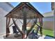 Backyard gazebo with seating and outdoor living space at 38144 W San Clemente St, Maricopa, AZ 85138