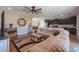 Inviting living room with open-concept design, wood floors, and cozy seating at 38144 W San Clemente St, Maricopa, AZ 85138