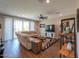 Cozy living room featuring a comfortable sofa, stylish decor, and a sliding glass door leading to a patio at 38144 W San Clemente St, Maricopa, AZ 85138