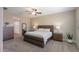 Serene main bedroom with ceiling fan, carpet floors, and ample natural light at 38144 W San Clemente St, Maricopa, AZ 85138