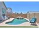 Inviting backyard pool with a rock waterfall feature, complemented by comfortable lounge chairs for relaxation at 38144 W San Clemente St, Maricopa, AZ 85138