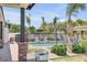 Expansive backyard featuring a built-in grill, pool, and lush landscaping at 3924 E Roma Ave, Phoenix, AZ 85018