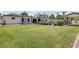 Expansive backyard with lush lawn, mature trees, and potential for outdoor activities and entertainment at 3924 E Roma Ave, Phoenix, AZ 85018