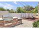 Backyard featuring a built-in stainless steel grill, swing set, and play area at 3924 E Roma Ave, Phoenix, AZ 85018