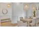 Elegant dining room with a modern pendant lighting, table with seating for eight at 3924 E Roma Ave, Phoenix, AZ 85018