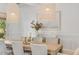 Bright dining room with modern pendant lighting and seating for eight, perfect for entertaining at 3924 E Roma Ave, Phoenix, AZ 85018