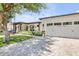 Charming home featuring a well-manicured lawn and a spacious three-car garage at 3924 E Roma Ave, Phoenix, AZ 85018