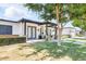 Charming home featuring a covered front entrance, manicured landscaping, and a lush green lawn at 3924 E Roma Ave, Phoenix, AZ 85018