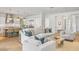 Bright, open-concept living space featuring a modern kitchen, stylish furnishings, and hardwood floors at 3924 E Roma Ave, Phoenix, AZ 85018