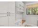 Well-designed mudroom with custom storage, seating, and natural light provides a practical and inviting entry space at 3924 E Roma Ave, Phoenix, AZ 85018