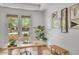 Cozy home office features natural light, stylish decor, and a comfortable workspace with a view of the outdoors at 3924 E Roma Ave, Phoenix, AZ 85018