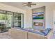 Cozy outdoor space with fireplace, TV, and comfortable seating for entertaining at 3924 E Roma Ave, Phoenix, AZ 85018