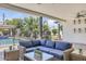 Relaxing covered patio featuring comfortable wicker furniture and a view of the pool at 3924 E Roma Ave, Phoenix, AZ 85018