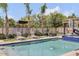 Relaxing pool area with lounge chairs, spa, and lush landscaping at 3924 E Roma Ave, Phoenix, AZ 85018