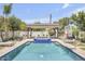 Stunning pool area with luxurious spa, lounge chairs, and lush landscaping at 3924 E Roma Ave, Phoenix, AZ 85018