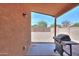View of a back patio featuring a barbecue grill, perfect for outdoor dining and entertaining guests at 40468 W Sanders Way, Maricopa, AZ 85138