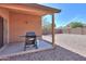 Back patio with barbecue grill, providing a space for relaxation and outdoor gatherings at 40468 W Sanders Way, Maricopa, AZ 85138