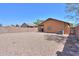 Spacious gravel backyard with a patio, ideal for low-maintenance landscaping and relaxing outdoors at 40468 W Sanders Way, Maricopa, AZ 85138