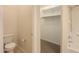 Bathroom including a toilet, shower-tub, and walk-in closet with ample storage space at 40468 W Sanders Way, Maricopa, AZ 85138