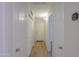 Hallway with wood floor and white doors at 40468 W Sanders Way, Maricopa, AZ 85138