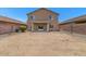 Large backyard, with potential for landscaping, connected to covered patio at 4380 W White Canyon Rd, San Tan Valley, AZ 85144