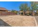 Large backyard with mature trees, block fence, and storage shed offering plenty of outdoor space at 4380 W White Canyon Rd, San Tan Valley, AZ 85144