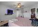 Comfortable bedroom featuring a TV, soft lighting, and cozy decor for relaxation at 4380 W White Canyon Rd, San Tan Valley, AZ 85144