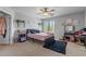 Cozy bedroom with plush bedding, stylish decor, and ample natural light at 4380 W White Canyon Rd, San Tan Valley, AZ 85144