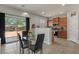 Bright dining area with a glass table, modern chairs, and seamless access to the kitchen at 4380 W White Canyon Rd, San Tan Valley, AZ 85144