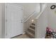 Welcoming foyer with tile flooring, staircase, and a bright white front door at 4380 W White Canyon Rd, San Tan Valley, AZ 85144