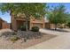 Charming two-story home with a well-manicured front yard and a two-car garage at 4380 W White Canyon Rd, San Tan Valley, AZ 85144