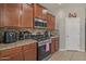 Modern kitchen featuring granite countertops, stainless steel appliances, and ample storage space at 4380 W White Canyon Rd, San Tan Valley, AZ 85144