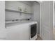Bright laundry room with white appliances and shelving at 4380 W White Canyon Rd, San Tan Valley, AZ 85144