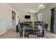 Spacious living room featuring modern decor, a sleek table setting, and comfortable seating arrangements at 4380 W White Canyon Rd, San Tan Valley, AZ 85144