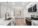 Bright kitchen features a stainless sink, white cabinets, modern appliances, and a stylish faucet at 5230 E Brown Rd # 114, Mesa, AZ 85205