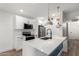 Modern kitchen offers white cabinets, stone countertops, and stainless steel appliances at 5230 E Brown Rd # 114, Mesa, AZ 85205