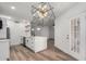 Contemporary kitchen with white cabinets, an island with a sink, and new appliances at 5230 E Brown Rd # 114, Mesa, AZ 85205