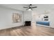 Open concept living space with fireplace, modern light fixtures, and eat-in kitchen at 5230 E Brown Rd # 114, Mesa, AZ 85205