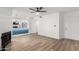 Open concept living space with fireplace, modern light fixtures, and eat-in kitchen at 5230 E Brown Rd # 114, Mesa, AZ 85205