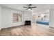 Open concept living space with fireplace, modern light fixtures, and eat-in kitchen at 5230 E Brown Rd # 114, Mesa, AZ 85205