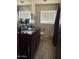 Bathroom with a double vanity, ample counter space, wood-look flooring, and bright natural light at 608 W 2Nd Pl, Mesa, AZ 85201